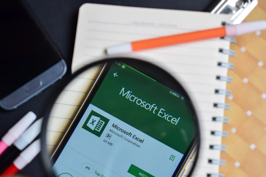 bekasi-west-java-indonesia-august-14 | Excel Help Magnifying glass focused on Excel app on smartphone screen.